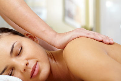 Portrait of young and calm female enjoying body massage